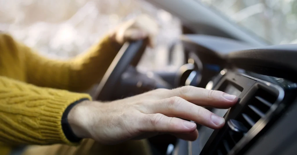 hand-holding-steering-wheel