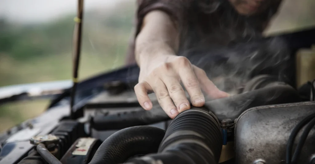 man-fixing-car-engine-roadside