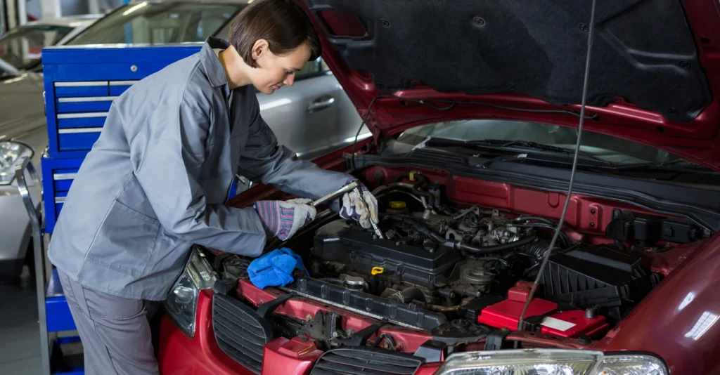 female_mechanic_checking_oil