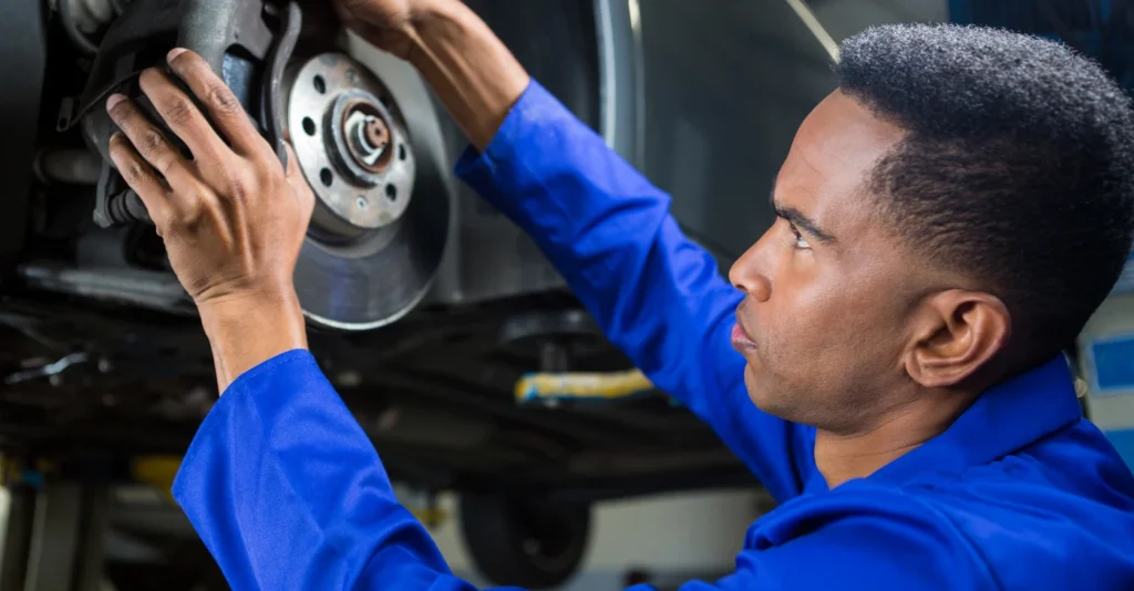 mechanic-fixing-car-brake