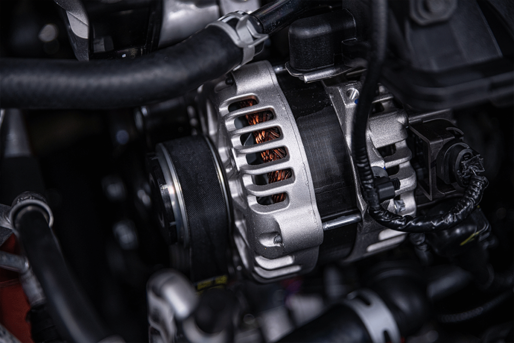 Close-up of a car alternator, showcasing its components and design, relevant to its lifespan and functionality.