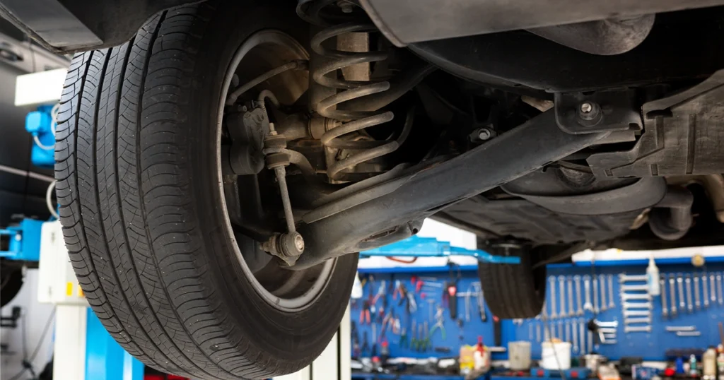 Close-up of a car strut and suspension system.