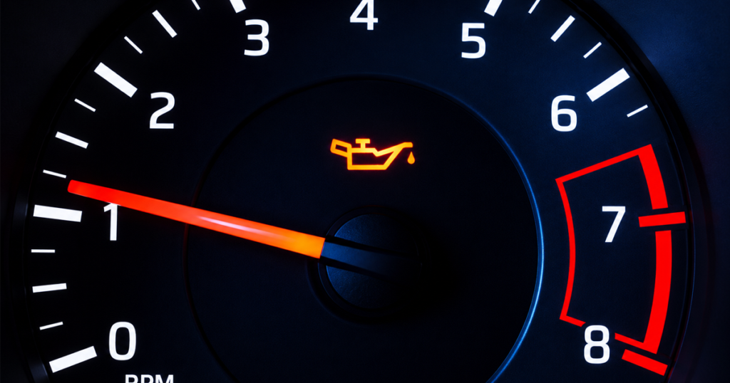 Car tachometer with oil warning light.