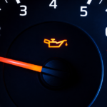 Car tachometer with oil warning light.