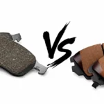 Worn brake pads compared with new brake pads.