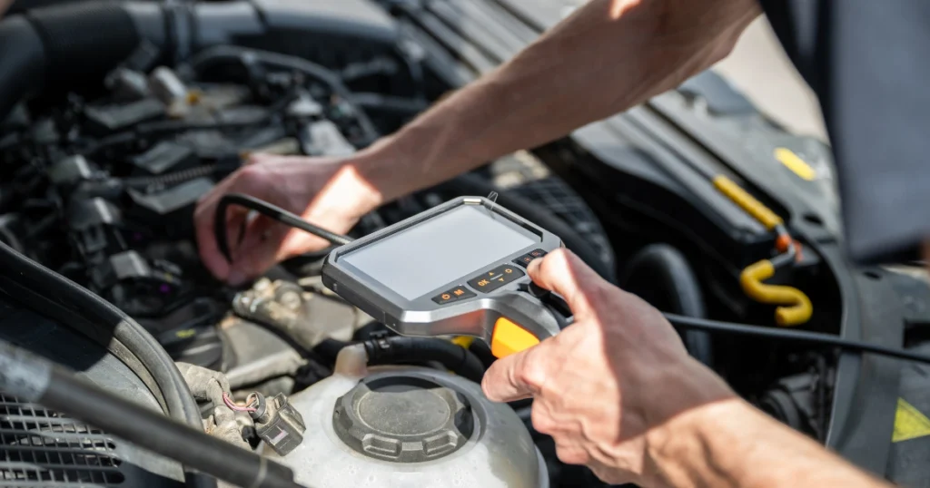 Car diagnostic test checking engine with scanner