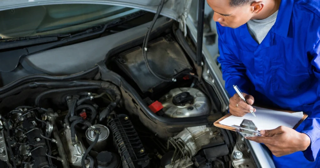 Mechanic performing a full auto repair inspection