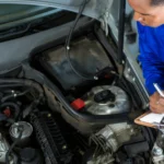 Mechanic performing a full auto repair inspection